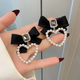 Midnight Bow Pearl Heart Earrings