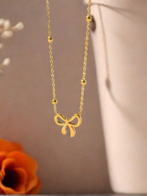 Golden Bow Bead Necklace