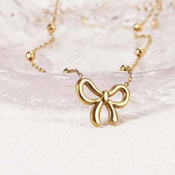 Golden Bow Bead Necklace